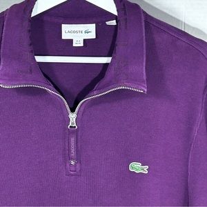 Lacoste half zip plum colored pullover.